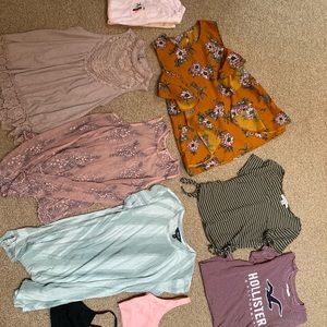 7 women’s shirts and 2 Skinnygirl bra tops.